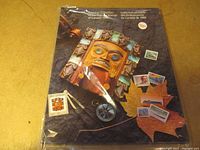 Cover of the souvenir collection folder showing Canadian themed artwork and postage stamps.