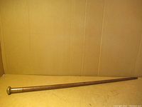 Full length of the wooden swagger stick showing overall condition and shape