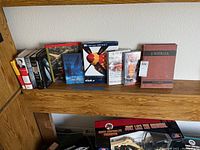 Photo showing an assortment of books including a book on aircraft, political and historical books.