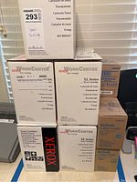 Boxed Xerox toner cartridges stacked together showing brands, models and series