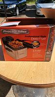 Box of Proctor Silex Professional Style Deep Fryer showing branding, capacity, and product features.