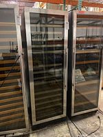 Front view of closed unit showing stainless steel frame and glass door next to adjacent units