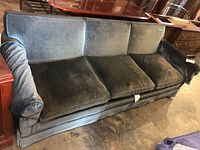 Front view of the 3-seat velour sofa showing wear and staining on cushions.