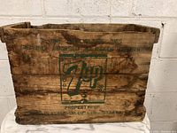 Front view of the vintage wooden 7 Up crate showing logo and overall condition.