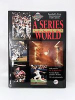 Front cover of book shows title, multiple color photographs from 1992 World Series and artistic text.