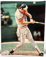 Signed 8x10 photograph of Cal Ripken Jr. batting, with JSA sticker in bottom left.