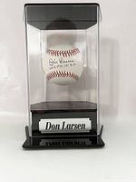 Front view of Don Larsen signed baseball in acrylic case with name plaque