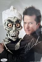 Closeup of Jeff Dunham and puppet Achmed with signature and James Spence Authentication sticker visible