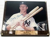 Frontal view of plaque showing signed photo, engraved nameplate, plexiglass cover