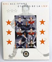 Front view of one NHL All-Stars 2002 uncut stamp sheet mounted in a white envelope with orange stars and NHL All-Stars text in English and French. The sheet shows six individual stamps featuring hockey legends Red Kelly, Howie Morenz, and Tim Horton, among others.