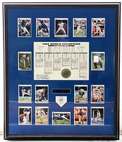 Full-view of framed piece showing mat, cards, stat sheet and frame