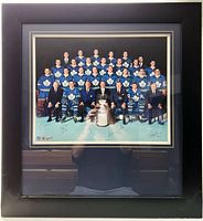 Full view of the framed picture showing the entire 1967 Toronto Maple Leafs team posing with the Stanley Cup, signed at the bottom.