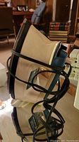 Image of Black and Decker iron showing its side, cord wrapped around the iron, and overall appearance.