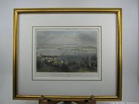 Framed engraving showing overall condition, gold painted wooden frame with some wear.
