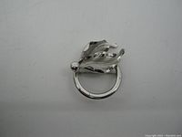 Front view of Bond Boyd sterling silver brooch showing leaf motif with circular frame.