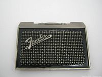 Front view of Fender amp style belt buckle showing logo and grill pattern with wear