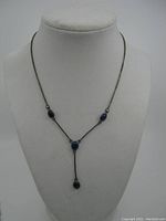 Full view of the silver chain necklace with lapis lazuli stones in Y-shaped design displayed on a bust.