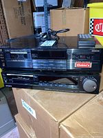 Front view of JVC stereo double cassette deck and Sony Video8 cassette recorder stacked, showing model details and control panels.