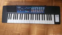 Full view of Casio CTK-120 keyboard showing keys, control panel, and speaker grilles.