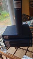 Four hardcover Cordon Bleu Cookery Course books stacked vertically showing titles on spines.