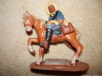 Buffalo Soldier statue showing full figure of soldier mounted on a horse with detailed uniform and horse features.