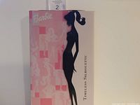 Front and side of the Barbie Timeless Silhouette doll box showing the branding and silhouette design.