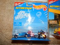 Home Improvement themed Hot Wheels Action Pack with diecast car and figure in blister pack.