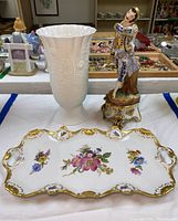 Front view of the set showing the tray, vase, and figurine on table