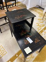 Side angle showing painted bird and floral designs on tabletop and lower surface, lattice side panel on raised shelf, tapered legs, and general condition.