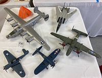 Overhead shot showing all five aircraft models on white table