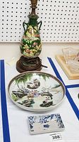 Front and side view of the lamp, art bowl, and decorative dish arranged on a table.