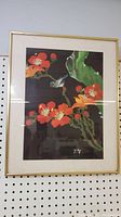 Full view of the framed Asian watercolor painting on silk showing the colorful bird and flowers with signature.