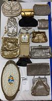 Top-down photo showing 13 vintage bags, the Seiko clock in cream case, and the oval vintage tray with floral design.