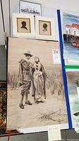 Overall view of the vintage prints and watercolor artwork set showing large Alfred Fredericks print and two framed silhouette prints above it