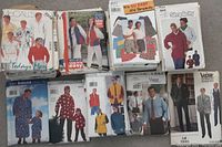 Photo of 9 patterns including men's shirts, jackets, pants, suits from McCall's, Butterick, Simplicity, and Vogue
