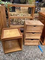 Photo of display shelf, cube storage, and palette drawer unit arranged outside; shows overall design and condition with visible wear.