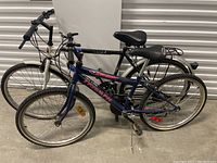 Two bicycles side by side showing overall condition and features including tires, seats, and frames