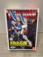 Box of Bandai V Dash Gundam model kit showing artwork and product labeling.