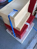 Boxed vintage Christmas decorations stacked in original boxes with labels