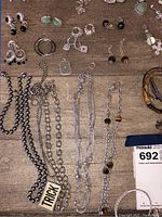 Close-up on necklaces and bracelets focusing on chain styles and pendants