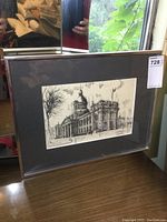 Front view of framed print showing the full piece including frame and reflection of surroundings.
