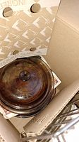 Visions amber glass cookware with lid inside cardboard box