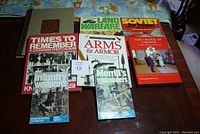 Photo of seven books related to war and Canadian history laid out on a surface, with titles and covers visible.