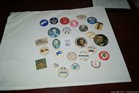 Full collection of 22 assorted political pins featuring Joe Clark, John Diefenbaker, Jean Pigott, and various PC Party slogans
