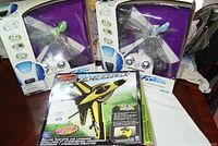 Two FlyTech Dragonfly RC helicopters in box with a FlyTech F/A-18 Hornet RC jet box in front