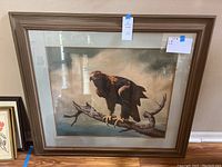 Full view of framed eagle print against wall, measuring approximately 38 by 41 inches.