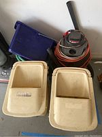 Overview of lot showing wet dry shop vacuum, beige pails, blue bucket with lid, and hoses.