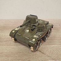 Front view of vintage Gama Tank 70 toy tank showing turret, cannon, and front details.