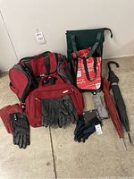 Photo showing two Samsonite bags in burgundy and black, three pairs of leather gloves (black and red), one pair of digital sport gloves, two full-size umbrellas, one compact umbrella, and two Lululemon tote bags including a refrigerated bag.