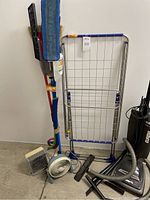 Full lot with vacuum, drying rack, heaters, fan and cleaning tools arranged against wall